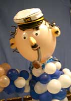Six foot tall Balloonatics balloon sculpture of a loveable seaman complete with seaman's hat and pipe