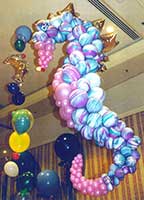 This five foot tall Balloonatics balloon sculpture of a seahorse is suspended from the ceiling as one of the decorations for a sea theme party