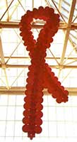 This 30 foot tall balloon sculpture of a Breast Cancer Ribbon is suspended from the ceiling at the San Jose Shark's Arena for a fund raising event