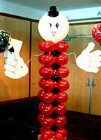 A 7 foot tall balloon column figure holding the ace of spades serves as an area decoration for casino theme parties