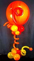 This orange and yellow balloon centerpiece gives a hot surreal modern look to this event.
